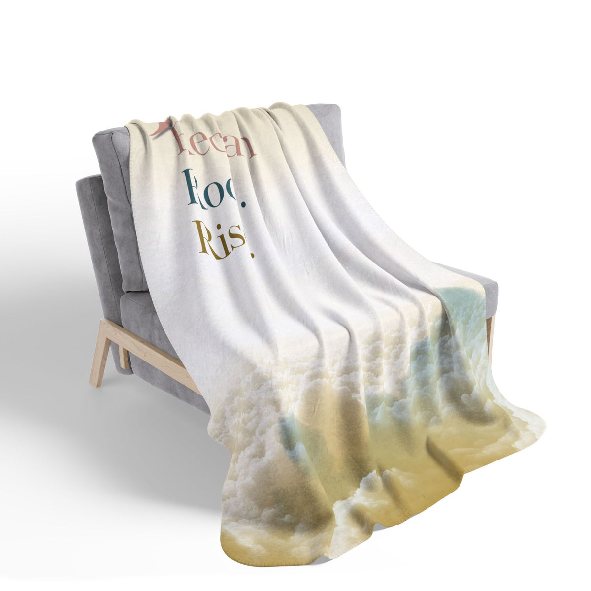 Nurse Sherpa Blanket — cream and gold cloud print draped over a gray armchair