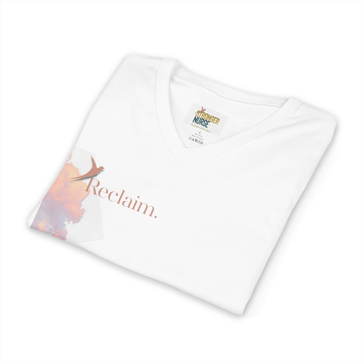 Nurse V-Neck Tee in white, folded — small left-chest "Reclaim." in terracotta with a rising bird beside a pink and orange watercolor splash, Stronger Nurse label visible at the neck