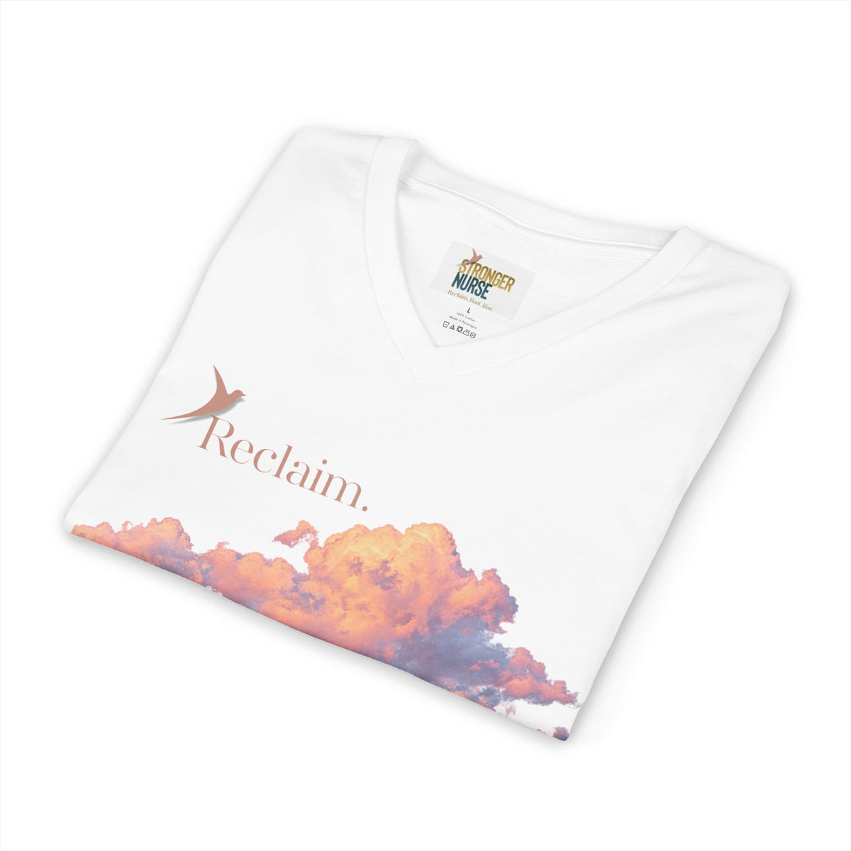 Nurse V-Neck Tee in white, folded — "Reclaim." in terracotta with a rising bird above sunset-orange clouds, Stronger Nurse label visible at the neck